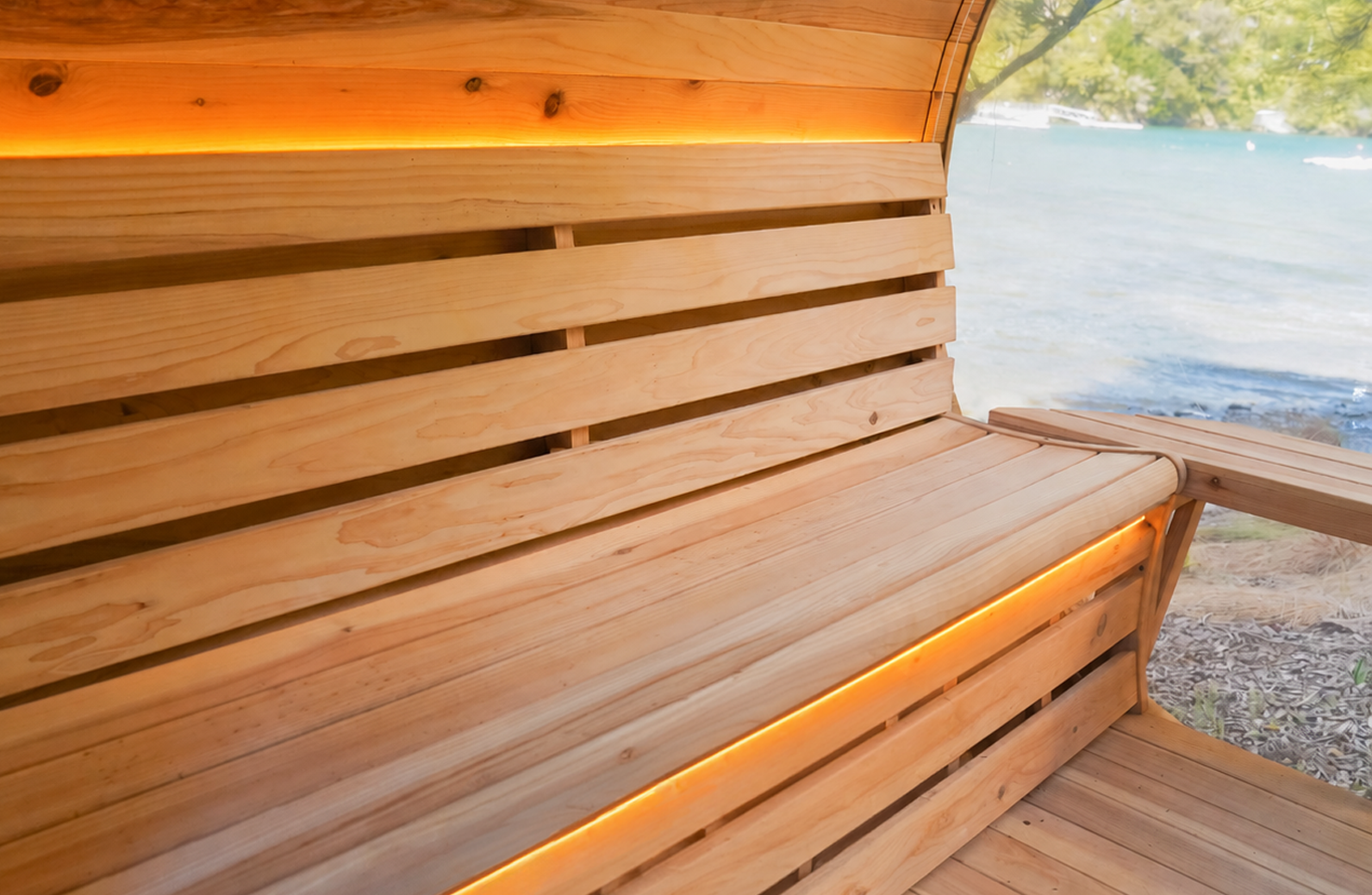 Wooden bench with warm LED lighting, set beside a large window overlooking water and trees.